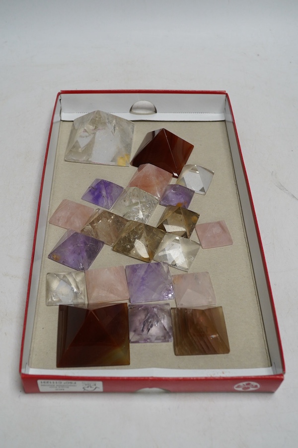 A collection of various carved stone ‘pyramids’ including rose quartz, tallest 4cm. Condition - fair